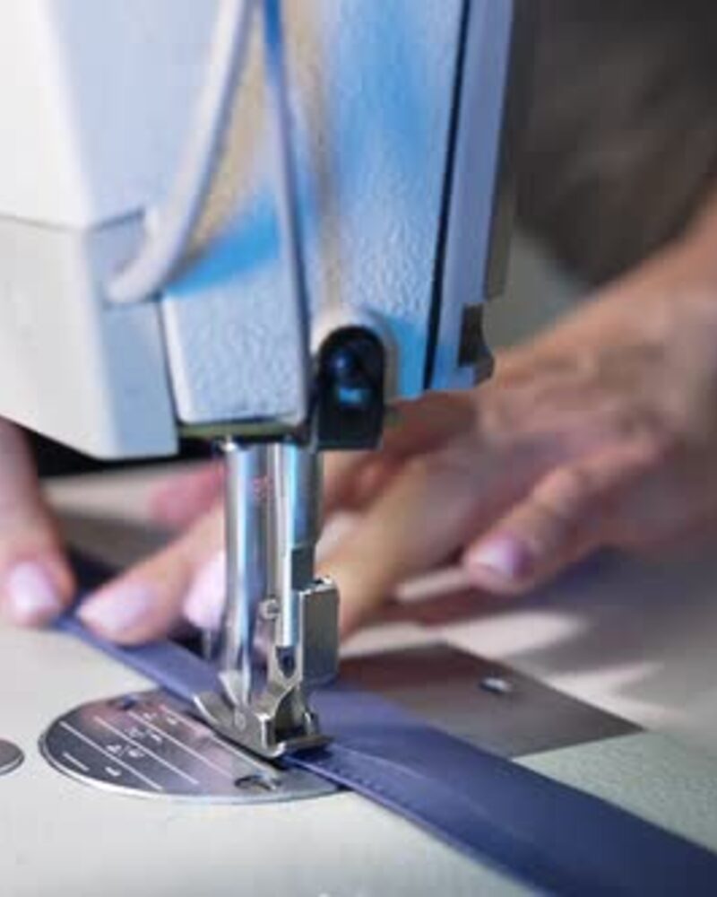 Tailor at sewing machine